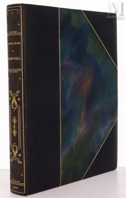 a black book with gold trimming and a black cover