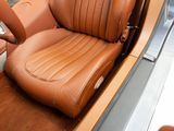a brown leather seat in the back of a car
