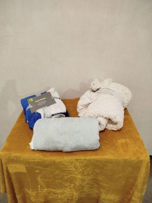 a yellow table with a yellow table cloth and a white towel on it