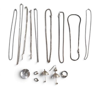a lot of different types of jewelry on a white surface