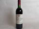 a bottle of wine that is sitting on a table