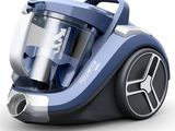 a blue and silver vacuum that is on a white surface