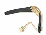 an image of a gold and black watch and a black strap