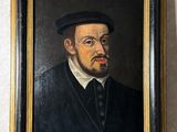 une peinture à l'huile représentant un homme vêtu d'un manteau noir et d'un chapeau