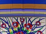a picture of a picture of a table cloth with flowers on it