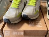 several pairs of running shoes are on display in a shoe store