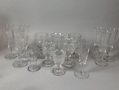 a lot of glasses that are sitting on a table