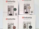 three boxes of brabantia coffee machines sitting on a table