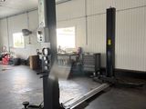 an image of a car being worked on in a garage