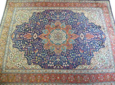 a close up of a rug on a floor with a white background