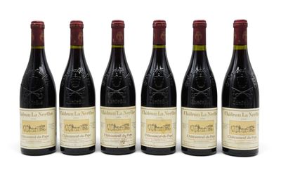 six bottles of wine are lined up on a white surface