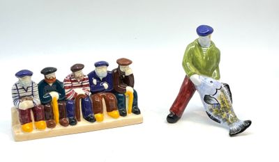 une figurine représentant un homme marchant à côté d'un groupe de figurines