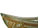 a glass bowl with a gold and green design on it