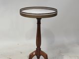 a round table with a wooden base and a metal tray on top