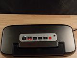 an image of a toaster sitting on a wooden table