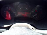 a close up of a car dashboard with a speedometer