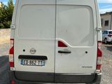 a white van that is parked in a parking lot