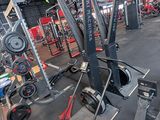 a view of a gym with a row of machines in it