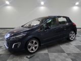 a blue car is parked in a room with a checkered floor