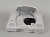 a white nintendo wii game system with a controller