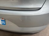 a close up of a car ' s bumper with a number plate on it