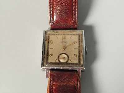 a watch that is sitting on top of a table