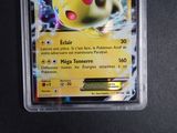 a close up of a pokemon card in a plastic container