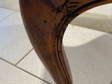 a close up of a chair with a cushion on it