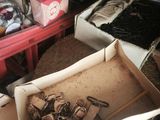 a box full of assorted items in the trunk of a car