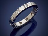 a white gold ring with diamonds on a blue background