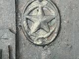 a metal door with a star on the top of it