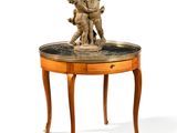 a small table with a statue on top of it