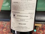 a bottle of wine that is being held by someone