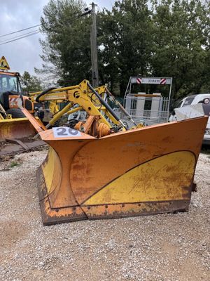 a yellow bulldozer that is sitting in the dirt