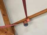 a picture of a room with a ceiling fan and wooden beams