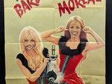 poster of two women in red dresses with a machine gun in front of them