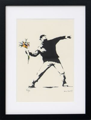 framed print of a man with a bouquet of flowers throwing a frisbee