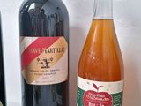 several bottles of wine are lined up on a table
