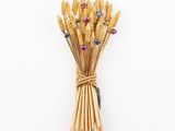 an image of a bunch of stalks of wheat on a white surface
