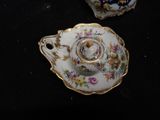a small cup and saucer sitting on a table