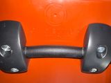 a close up of a pair of dumbs on the handle of an orange suitcase