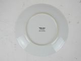 a white plate with a black and white label on it