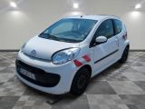 a picture of a small white car on a checkered floor