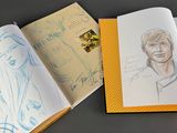 a book with a drawing of a man and a woman inside of it