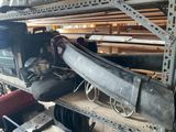 a pile of assorted items on a shelf in a garage