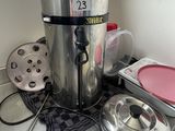 a coffee pot sitting on top of a counter next to other kitchen items
