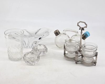 three pieces of glass and silverware sitting on a white surface