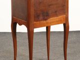 an image of a small wooden table with a drawer on it