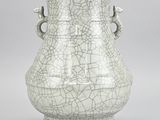 a white vase that has a cracky design on it
