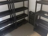 a room that has shelves and bins in it